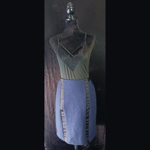 Black bodysuit pair with navy blue skirt